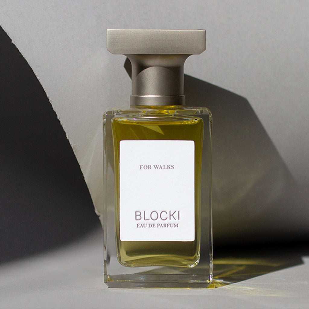 Stylized photo of 50ml glass bottle of For Walks perfume