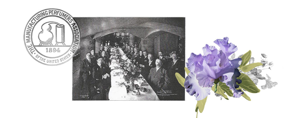 perfumers sitting at long dining table with flower arrangements