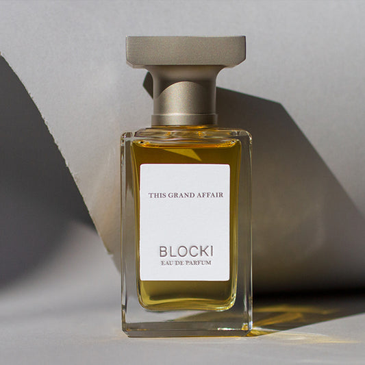 Stylized photo of 50ml glass bottle of This Grand Affair perfume